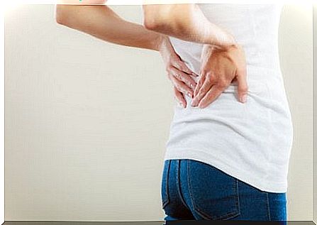 Woman experiences back pain from ankylosing spondylitis