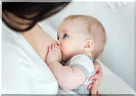 A baby breastfeeding from its mother. 