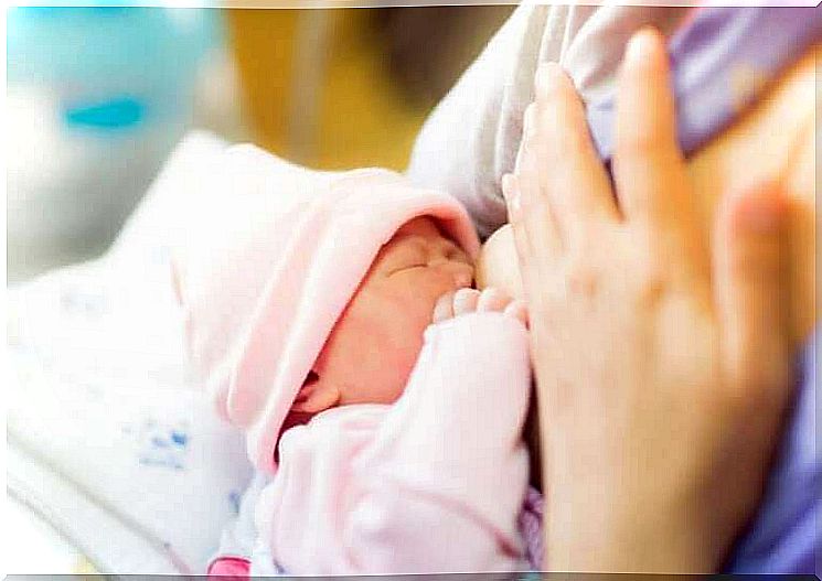 A baby feeding on breast milk